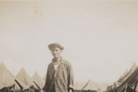 Man in middle of dirt road (ddr-janm-17-59)