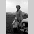 Woman and child in front of car (ddr-densho-1007-1252)