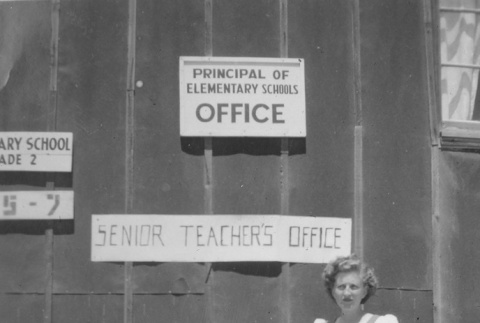 Evelyn Dell in front of the teacher's office (ddr-densho-152-25)