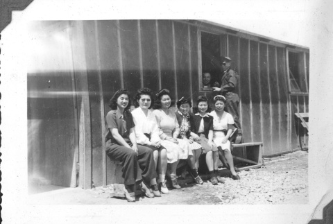 Group of Japanese Americans in front of barracks (ddr-densho-157-46)