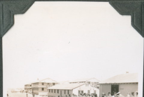 Group of men lined up outside building (ddr-ajah-2-108)