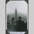 A man and woman looking at the Empire State Building (ddr-densho-201-770)