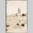 Man with child on his shoulders, with dog (ddr-densho-523-74)