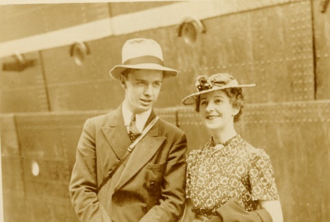 A couple posing in front of a ship (ddr-njpa-1-1482)