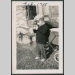 Photo of a child next to a pram (ddr-densho-483-714)