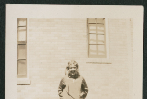 girl in front of a building (ddr-densho-378-344)