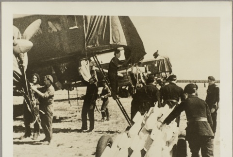 Photo of men performing maintainence on French planes (ddr-njpa-13-1334)