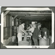 Photograph of men washing dishes at Manzanar incarceration camp (ddr-csujad-47-25)
