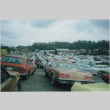 Cars lined up waiting to caravan down to Puyallup (ddr-densho-384-12)