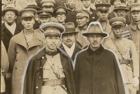 Chiang Kai-shek standing with other men in uniform (ddr-njpa-1-1755)
