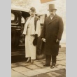 A couple standing next to a car (ddr-njpa-1-2267)