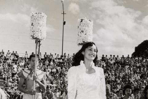 Young woman walking in the Pan Pacific Festival parade (ddr-njpa-2-105)