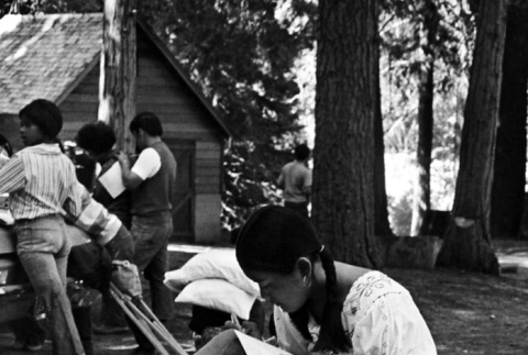 Campers signing photos at the end of camp (ddr-densho-336-250)
