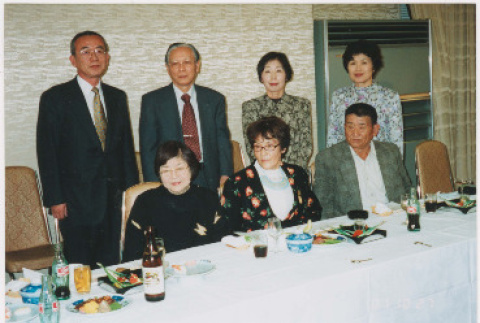 Three men and four women at banquet (ddr-densho-422-573)