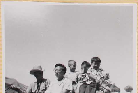 Hardy Shiomi with three boys and wagon driver on covered wagon (ddr-densho-522-318)
