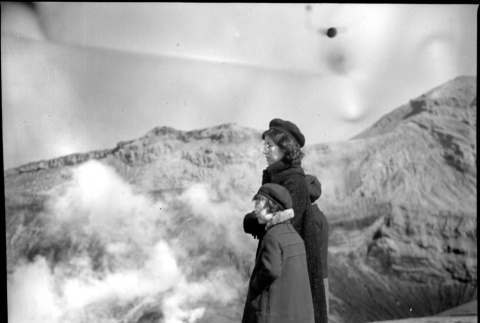 Woman and two children overlooking volcano (ddr-densho-426-285)