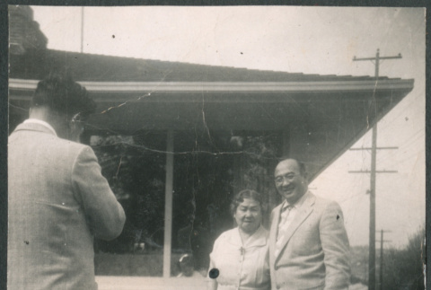 Couple with dog getting their picture taken (ddr-densho-523-271)