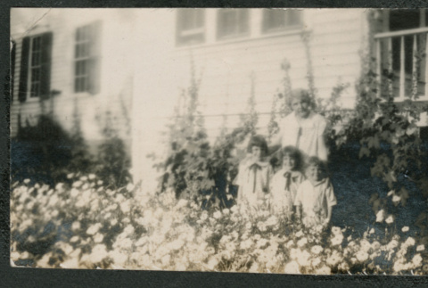 woman and three kids outside a house (ddr-densho-378-689)