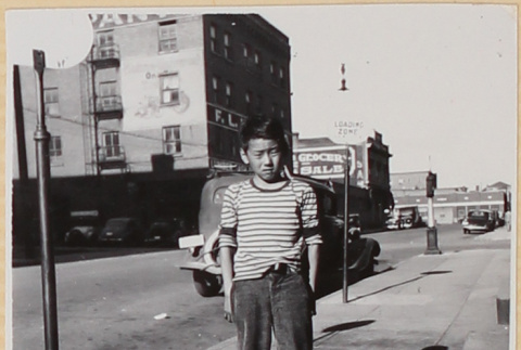 Boy standing on sidewalk (ddr-densho-522-50)