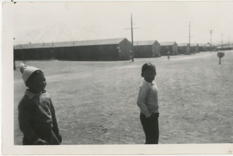 Two boys standing on a camp street (ddr-manz-7-6)