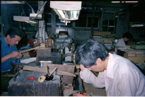 Men seated at work benches (ddr-densho-426-555)