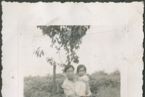 Momoye Tanaka holding Lois Sakahara (ddr-densho-316-49)