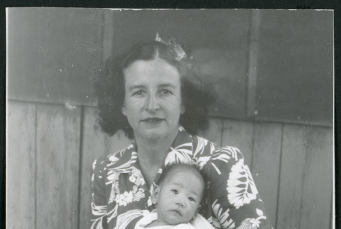 Photograph of Irene Gavigan holding an infant at Manzanar (ddr-csujad-47-226)