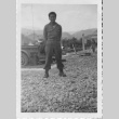 [Man in military uniform standing outside] (ddr-csujad-1-35)
