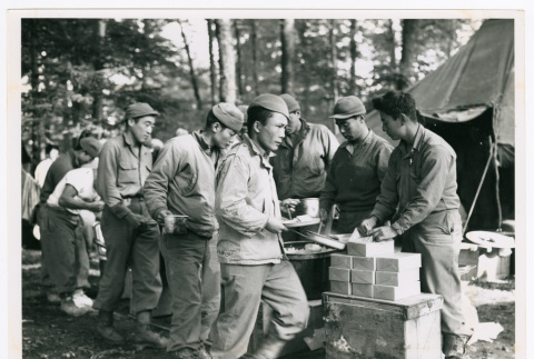 Members of the 100th Infantry Battalion having meal in bivouac (ddr-densho-1007-153)