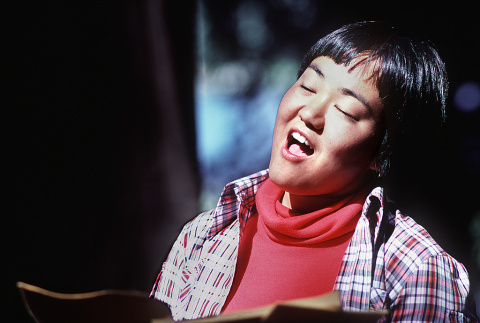 Ann Shimakawa singing during morning watch (ddr-densho-336-1247)