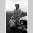 Woman and child in front of car (ddr-densho-1007-1254)