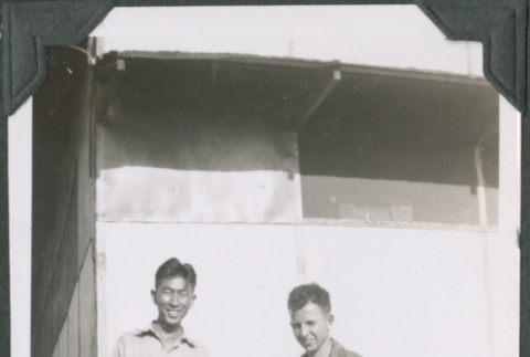 Two men standing by barrel.  Joe Iwataki on left (ddr-ajah-2-641)