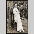 Woman leaning against a tree (ddr-densho-404-113)