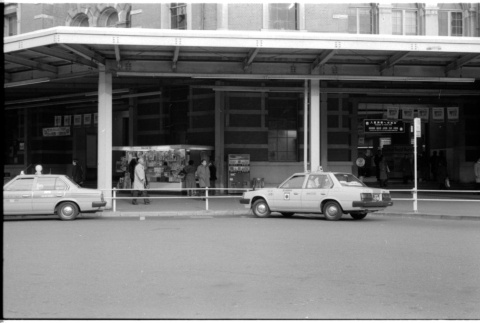 Two taxis at Tokyo Station (ddr-densho-1007-1186)