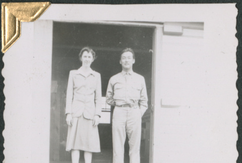 Man and women standing on loading dock (ddr-densho-434-238)