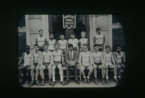 (Slide) - Image of boys basketball team outside building (Maryknoll school) (ddr-densho-330-162-master-7196404c7f)