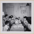 Group playing Monopoly (ddr-densho-522-551)