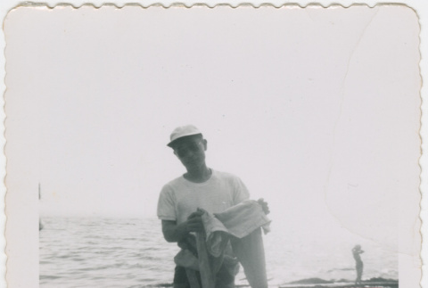 Man standing on beach (ddr-densho-430-300)