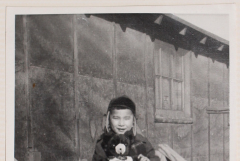 Photo of a boy with a teddy bear (ddr-densho-483-414)