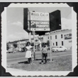 Two children posing under the Weed, California town sign (ddr-densho-300-585)