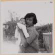 Yoshiko Shiomi holding Susan Shiomi (ddr-densho-522-141)