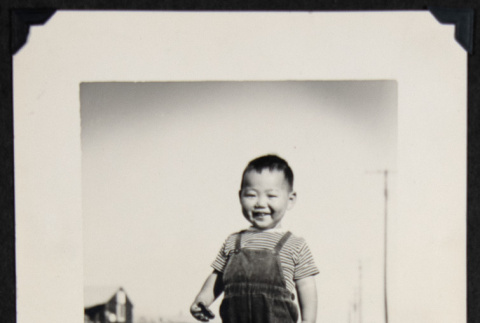 Smiling Kunikazu in cowboy boots (ddr-densho-542-672)