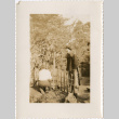 Man and woman in garden (ddr-densho-426-1418)
