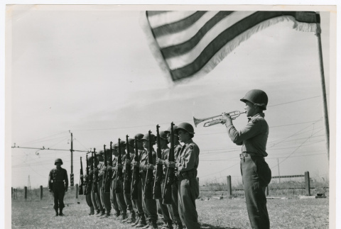 Bugler Pfc. Chales Kimura plays taps at memorial service (ddr-densho-1007-148)