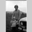 Woman and child in front of car (ddr-densho-1007-1251)