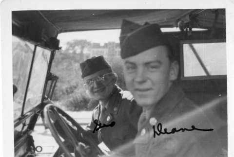 [Two men in military uniform in military vehicle] (ddr-csujad-1-18)