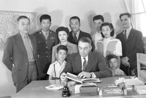 Ben Kuroki and others gathered in Harry L. Stafford's office (ddr-fom-1-363)