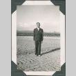 Noboru Sakahara standing in field (ddr-densho-316-334)