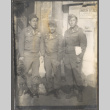 Three men standing outside Red Cross (ddr-densho-466-63)