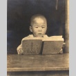 Young boy with a book (ddr-njpa-4-2317)